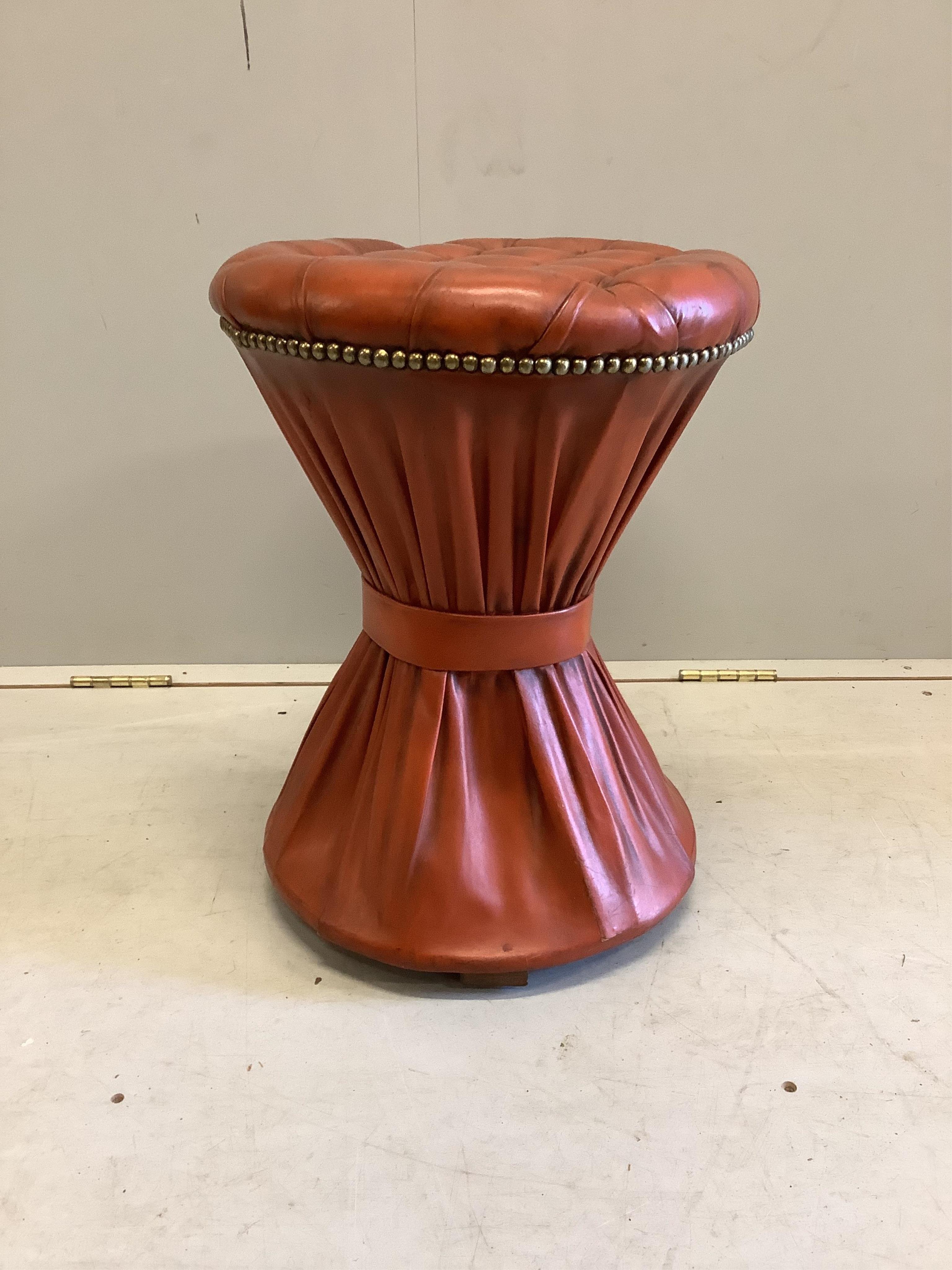 Two “book-stack” storage boxes, a ditto cabinet and a red leather brass studded circular stool, diameter 39cm, height 49cm